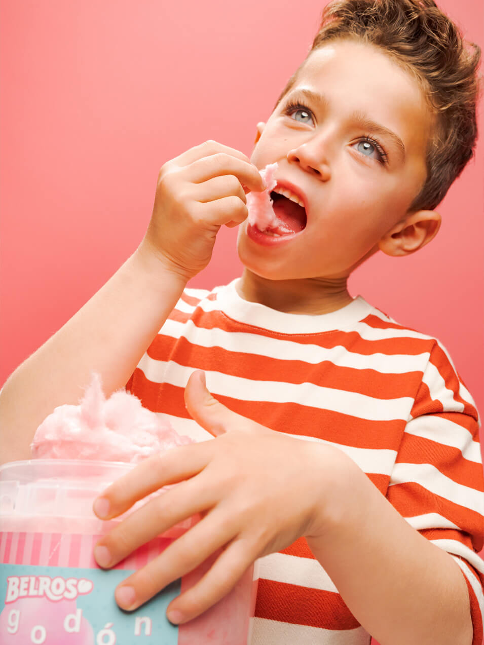 Image of Boy eating cotton candy